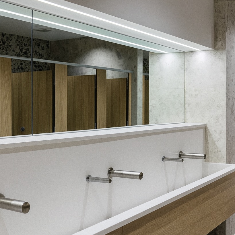 Stainless steel automatic soap dispenser in commercial kitchen