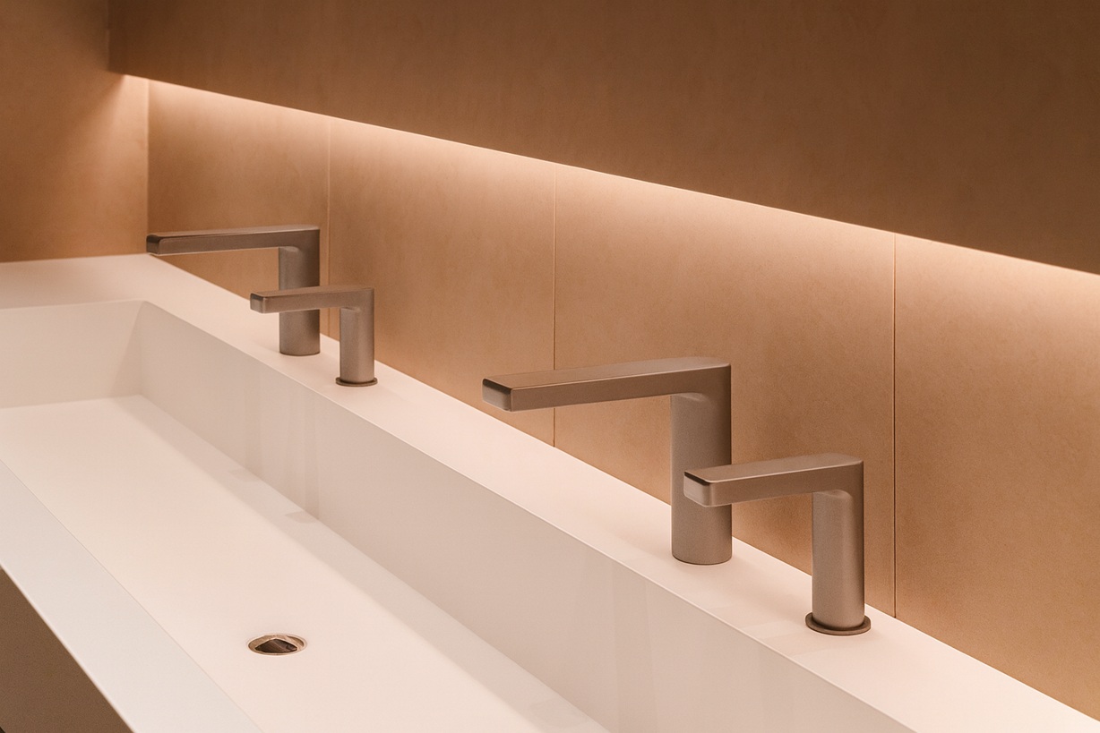 Queue of users moving quickly through a public restroom