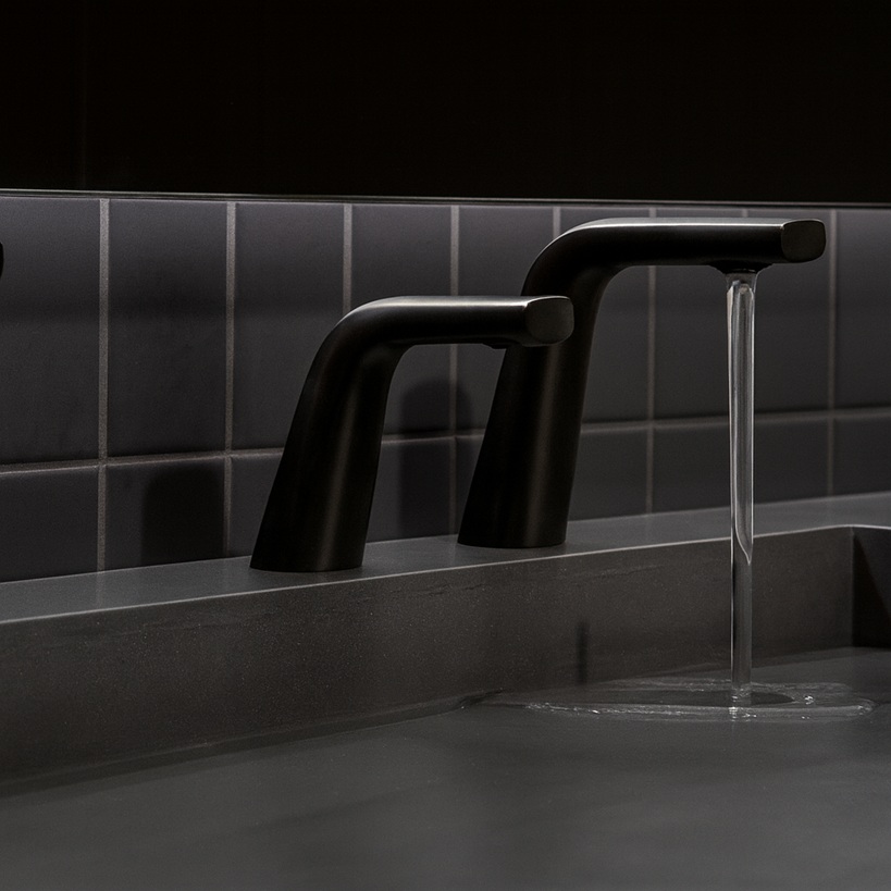 Stainless steel automatic soap dispenser in office washroom