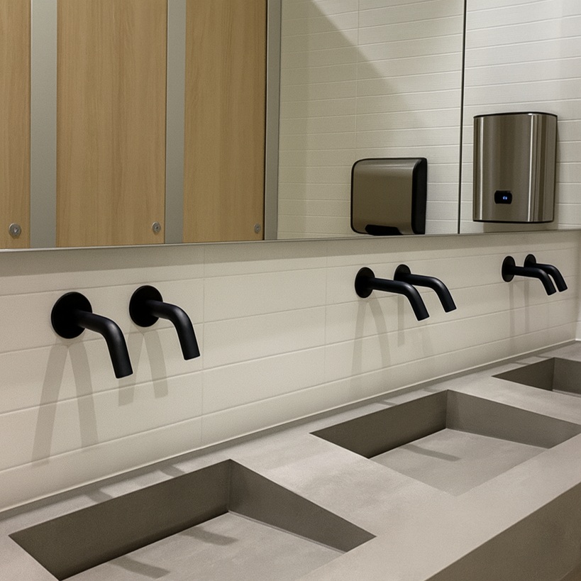Front-of-house restroom with automatic soap dispensers